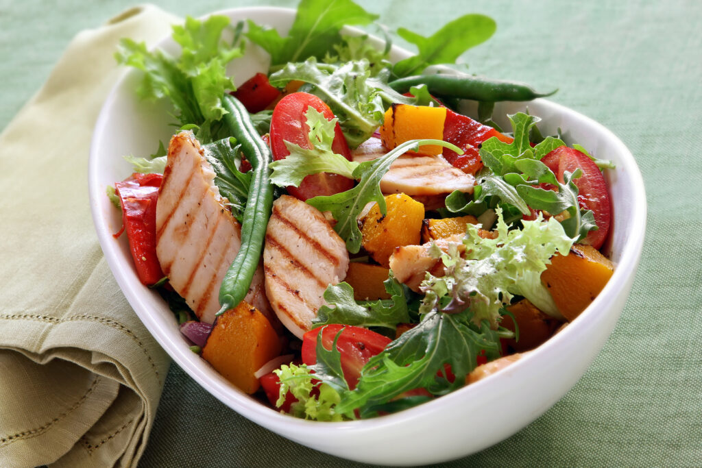 Nutrition Orewa &mdash; a colourful salad with roasted vegetables and grilled chicken