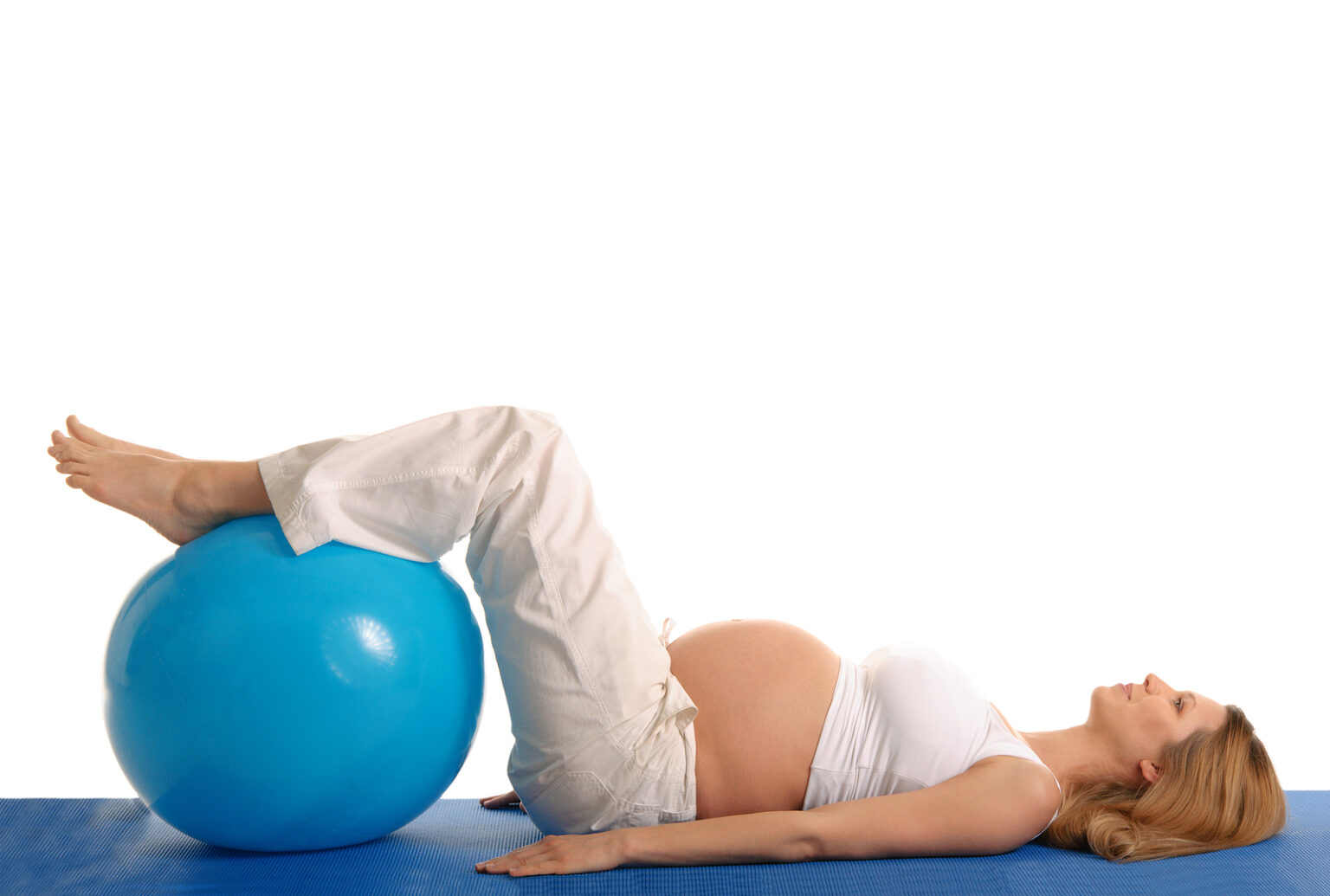 Pregnancy Pain Auckland 2 Pregnant woman exercising with her legs resting on an exercise ball