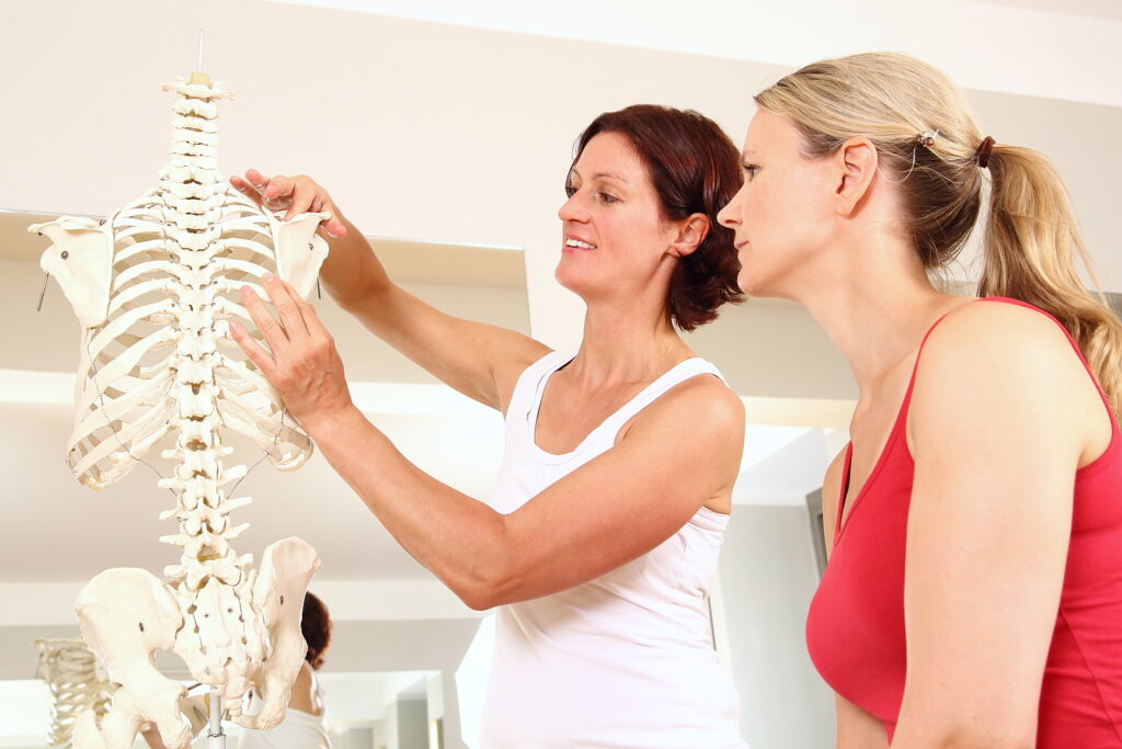 Registered practitioner treating a patient at Premier Wellness Auckland
