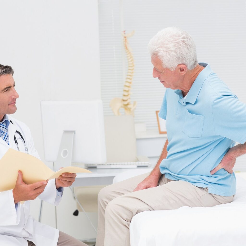 Practitioner reviewing an ACC claim with a patient at the first appointment