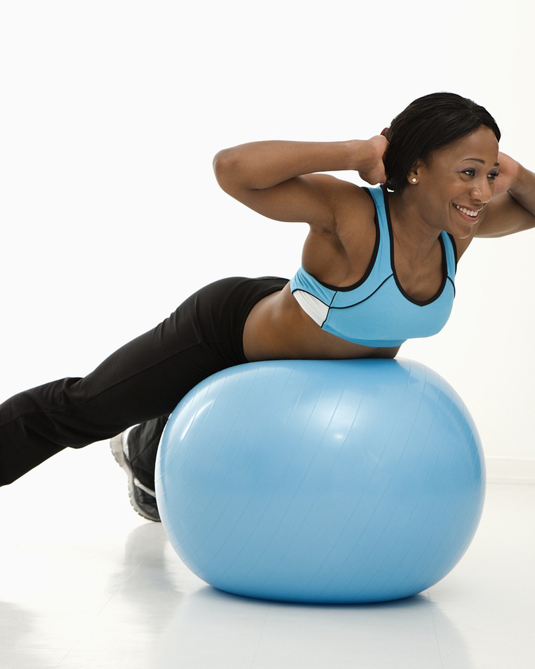 Sports Physio Auckland 3 Woman doing a back extension exercise over a Swiss ball